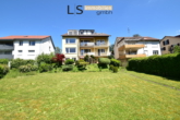 Gartenansicht - Wohntraum mit Potenzial: 4,5-Zimmer-Etagenwohnung mit 2 Balkonen, Garage & Garten in Oberesslingen!